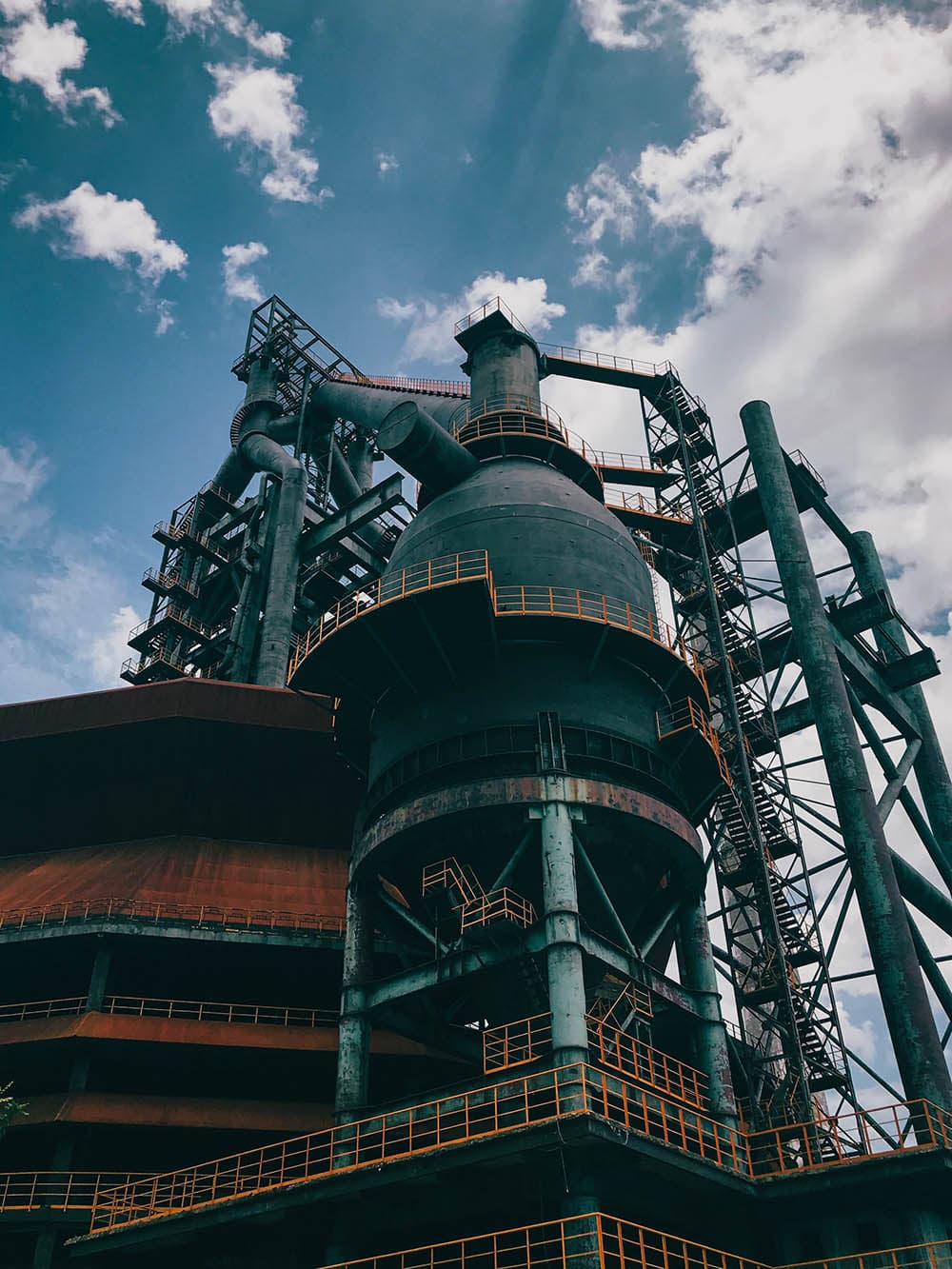 a large industrial building with a large tower